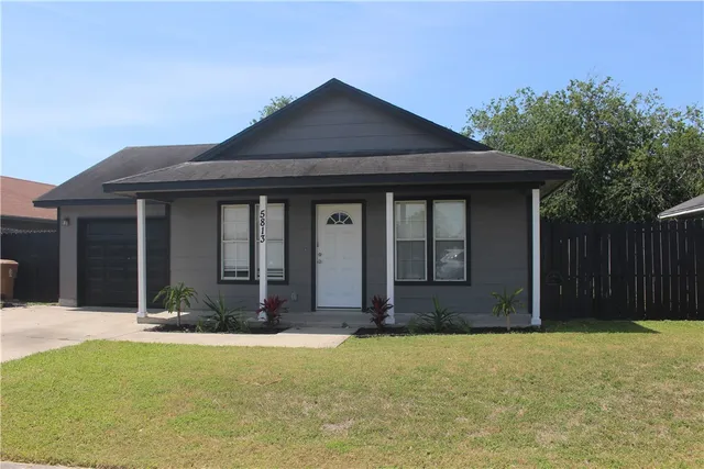 a view of house with yard