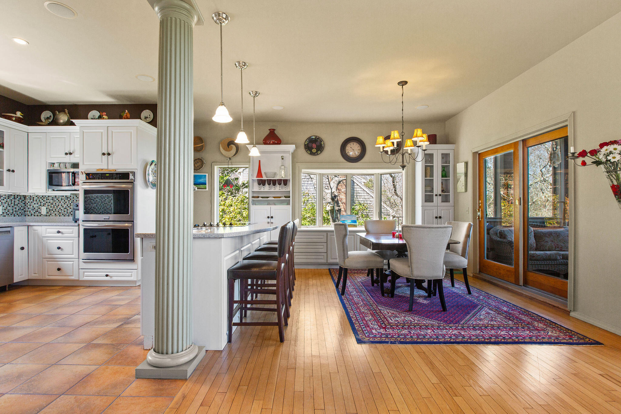 10 Somerset Road Provincetown, MA 02657 - Photo 11 of 50 a dining room with furniture and wooden floor