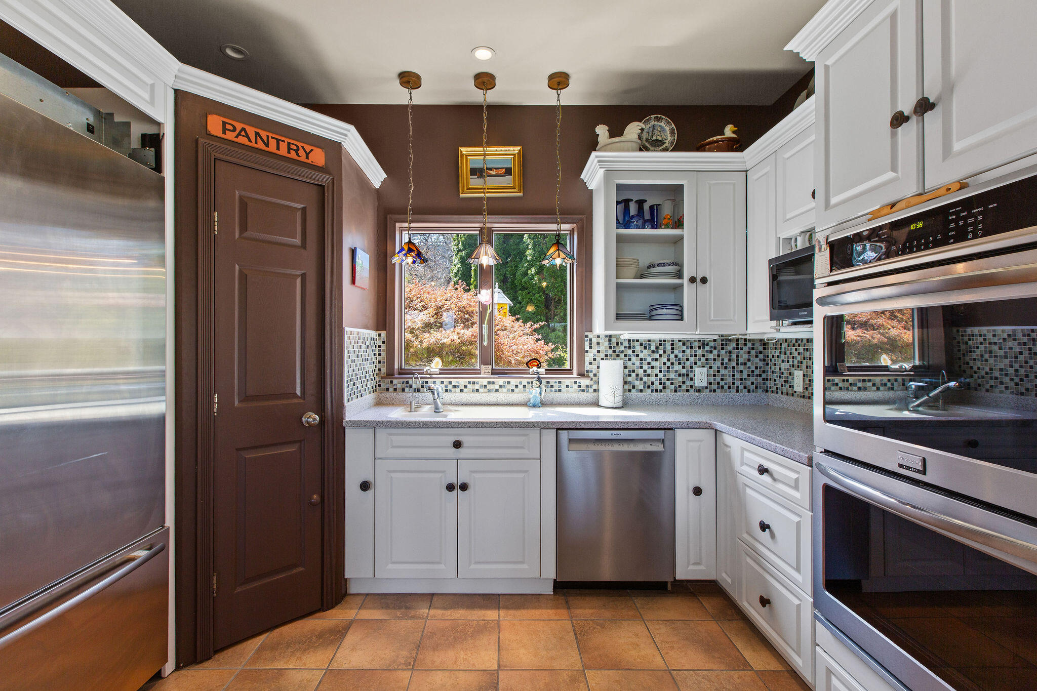 10 Somerset Road Provincetown, MA 02657 - Photo 16 of 50 a kitchen with stainless steel appliances granite countertop a stove and a refrigerator