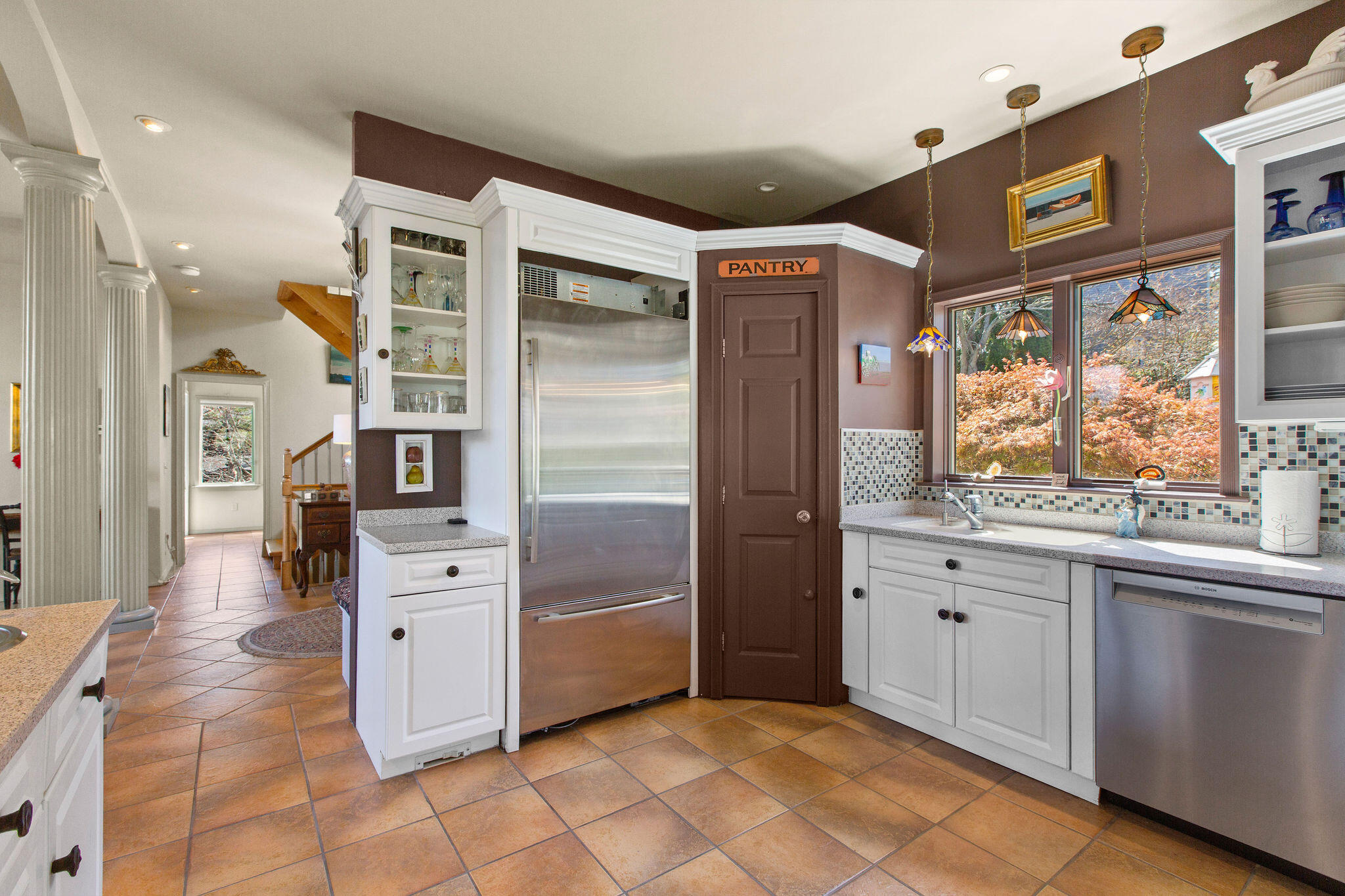 10 Somerset Road Provincetown, MA 02657 - Photo 17 of 50 a kitchen with stainless steel appliances kitchen island granite countertop a refrigerator and cabinets