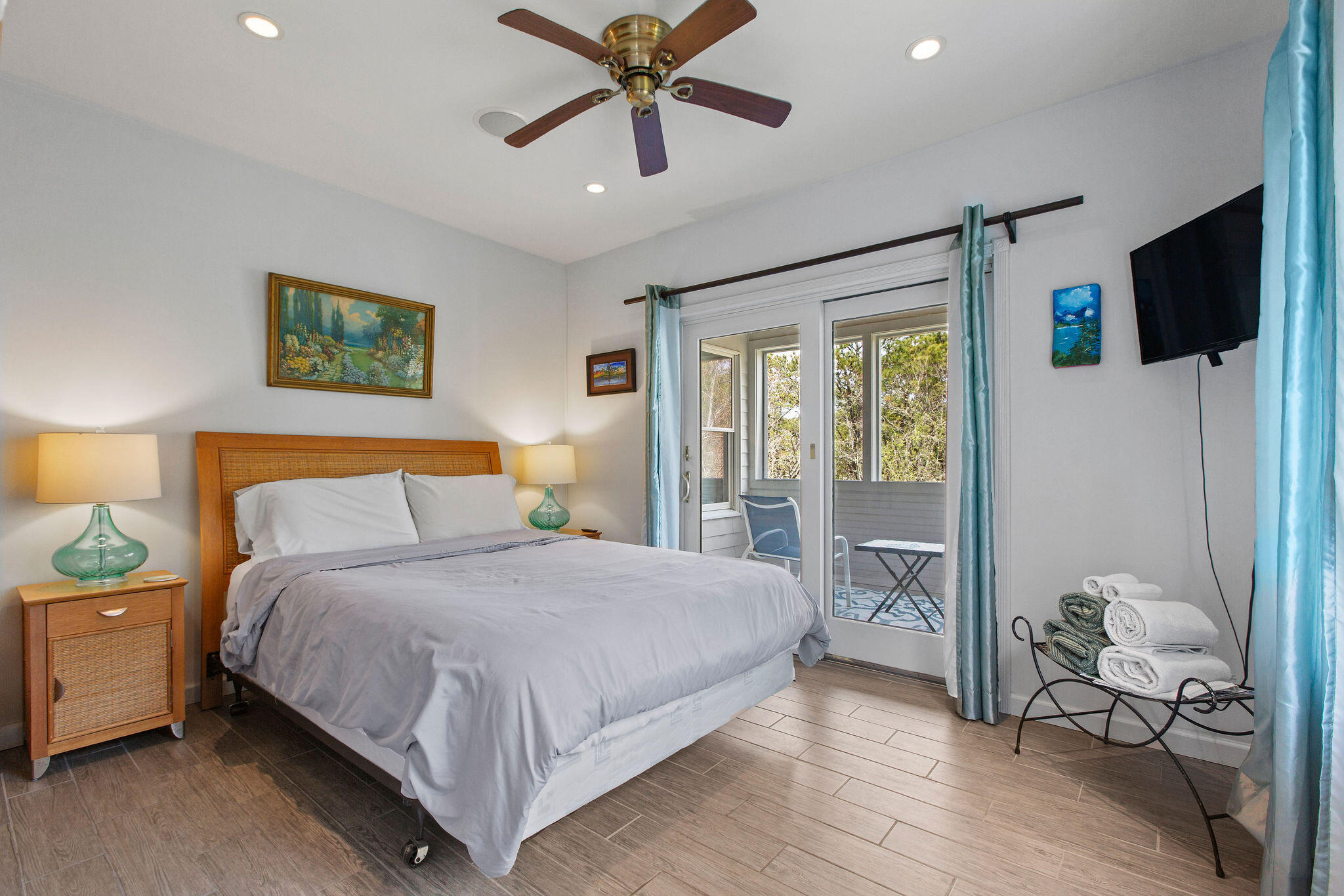10 Somerset Road Provincetown, MA 02657 - Photo 43 of 50 a bedroom with a bed and wooden floor