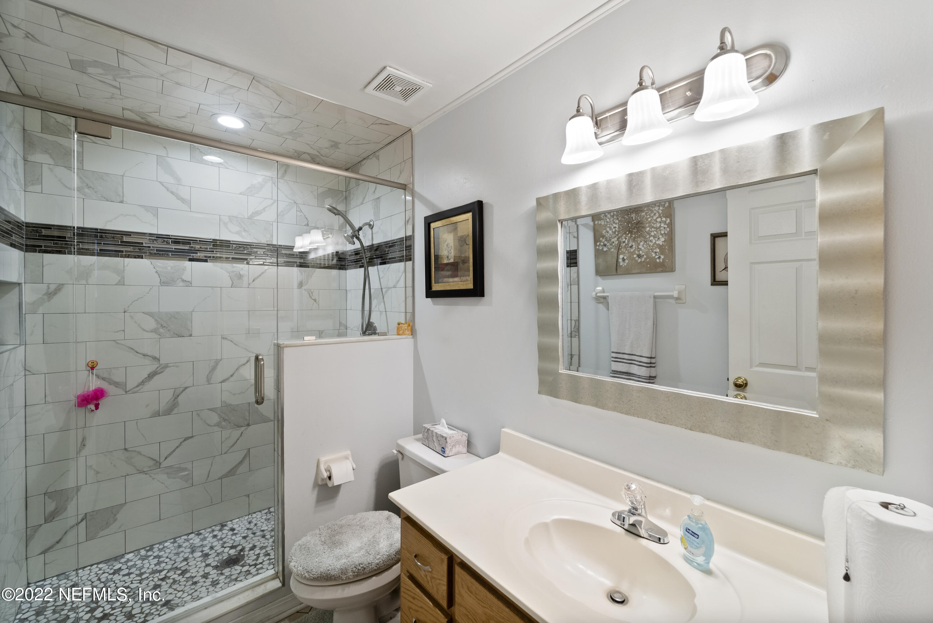 12855 Moose Road Jacksonville, FL 32226 - Photo 22 of 29 a bathroom with a sink toilet and shower