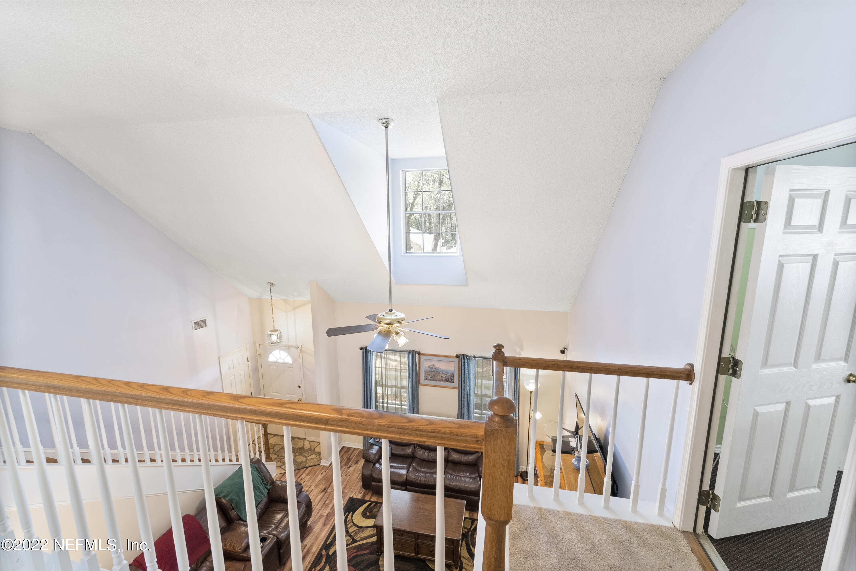 12855 Moose Road Jacksonville, FL 32226 - Photo 24 of 29 a view of staircase with railing and white walls