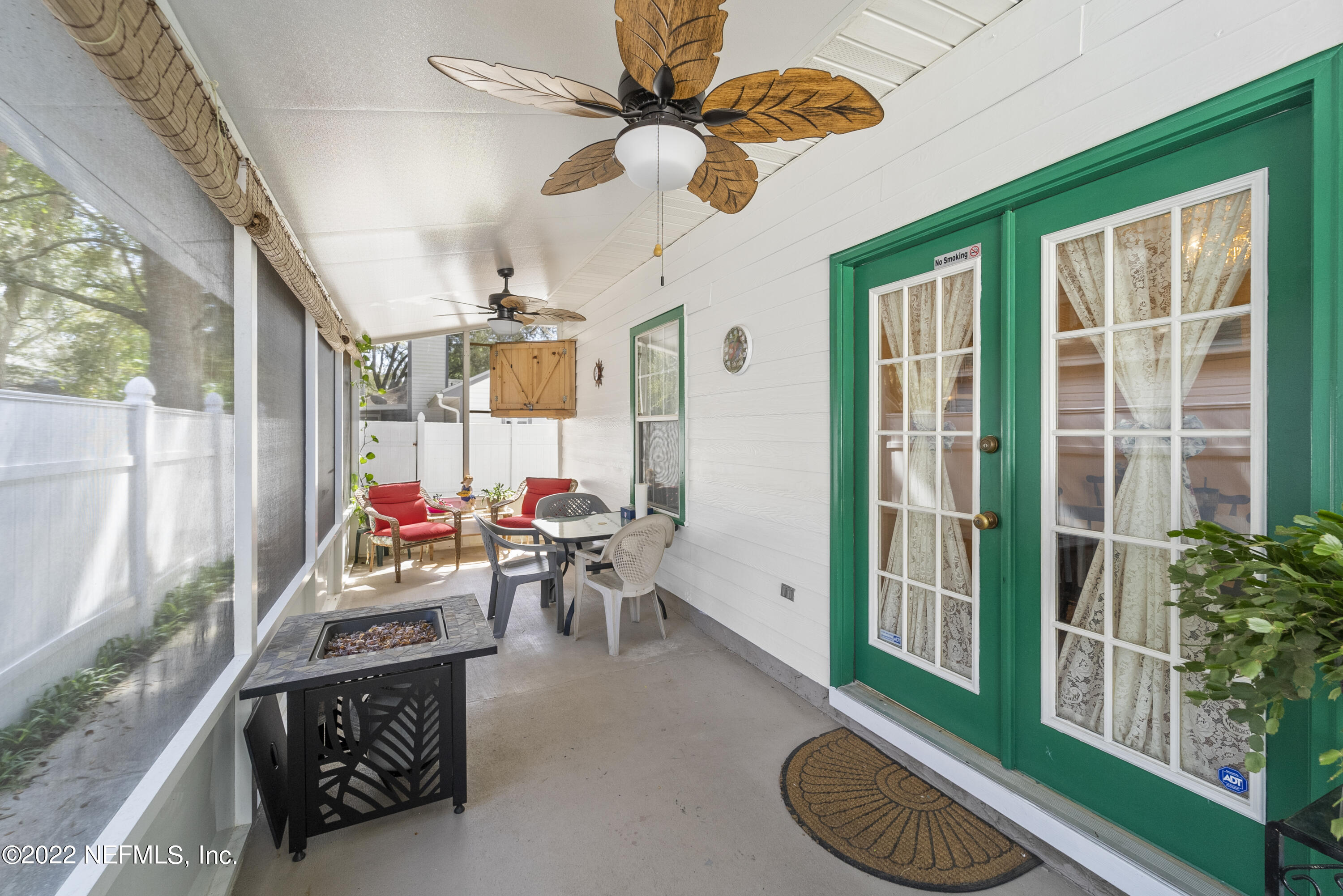 12855 Moose Road Jacksonville, FL 32226 - Photo 10 of 29 a living room with furniture and a floor to ceiling window