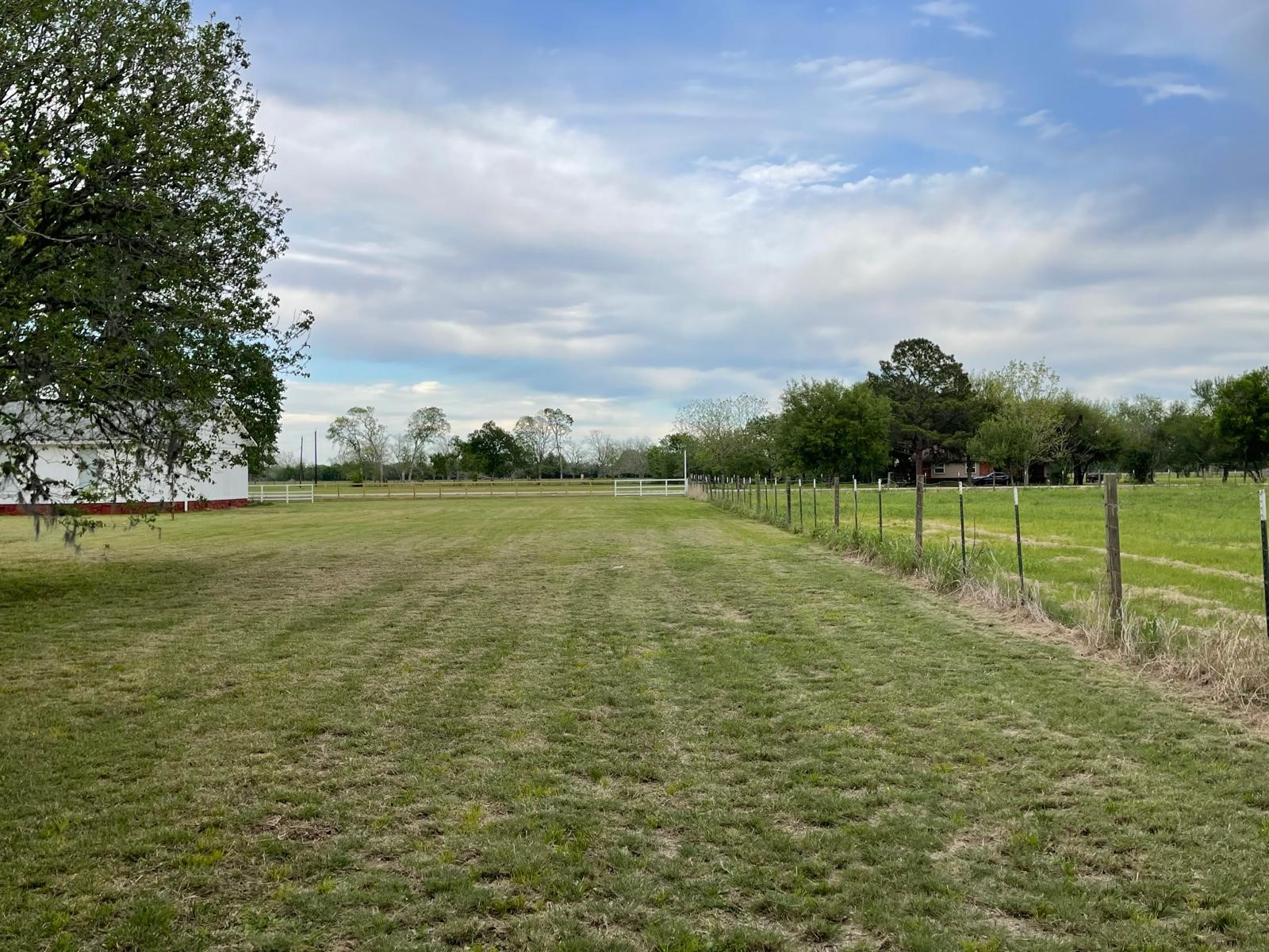 335 Carroll Road Richmond, TX 77469 - Photo 23 of 25 a view of a field with wooden fence