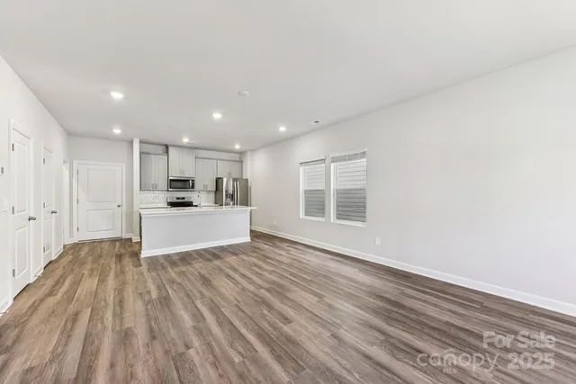 a view of kitchen with wooden floor