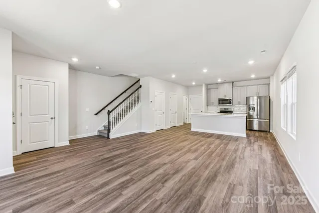 a view of kitchen and wooden floor