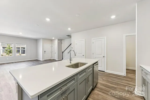 a kitchen with a sink and a refrigerator