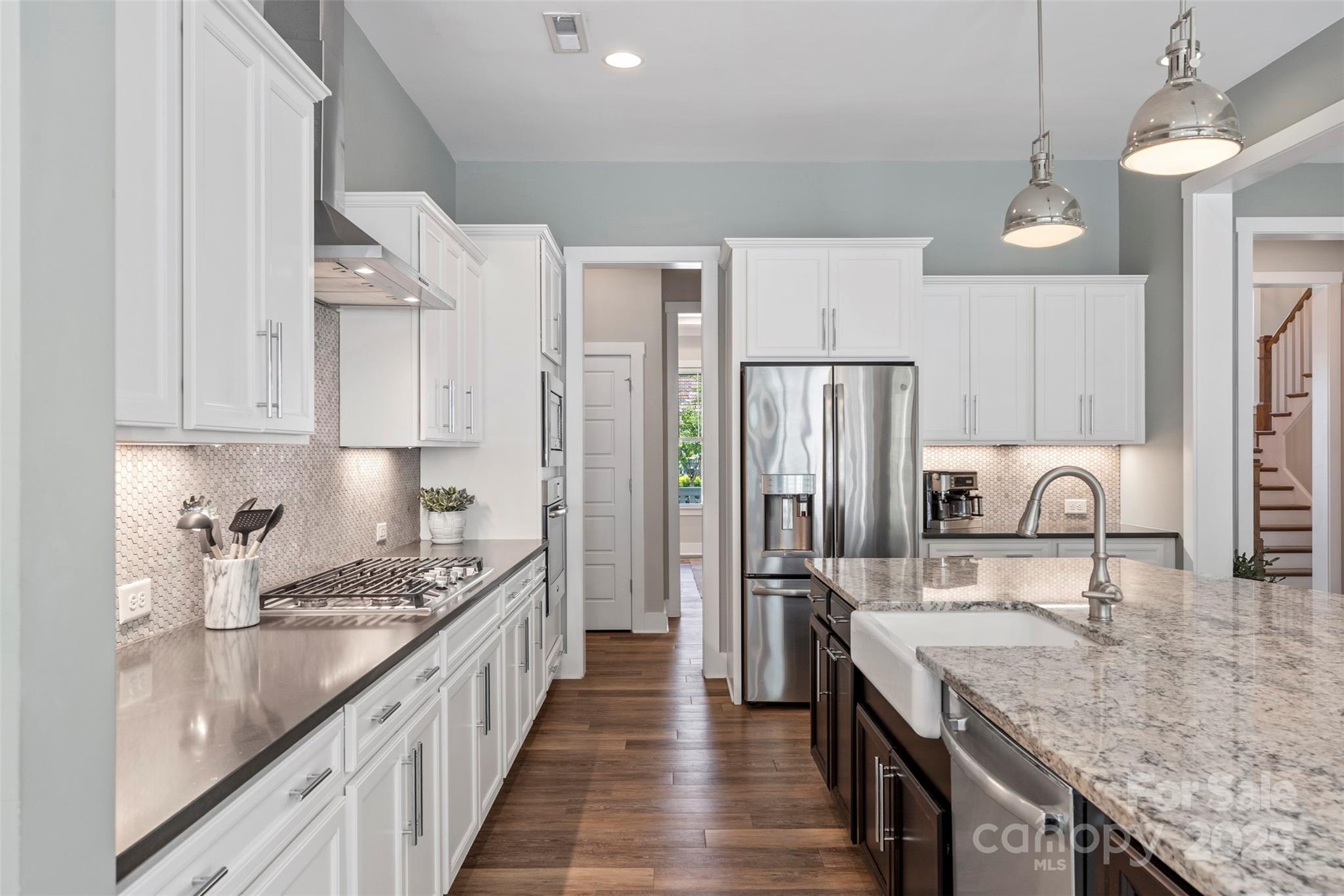 2052 Masons Bend Drive Fort Mill, SC 29708 - Photo 13 of 41 a kitchen with stainless steel appliances granite countertop a sink stove and refrigerator