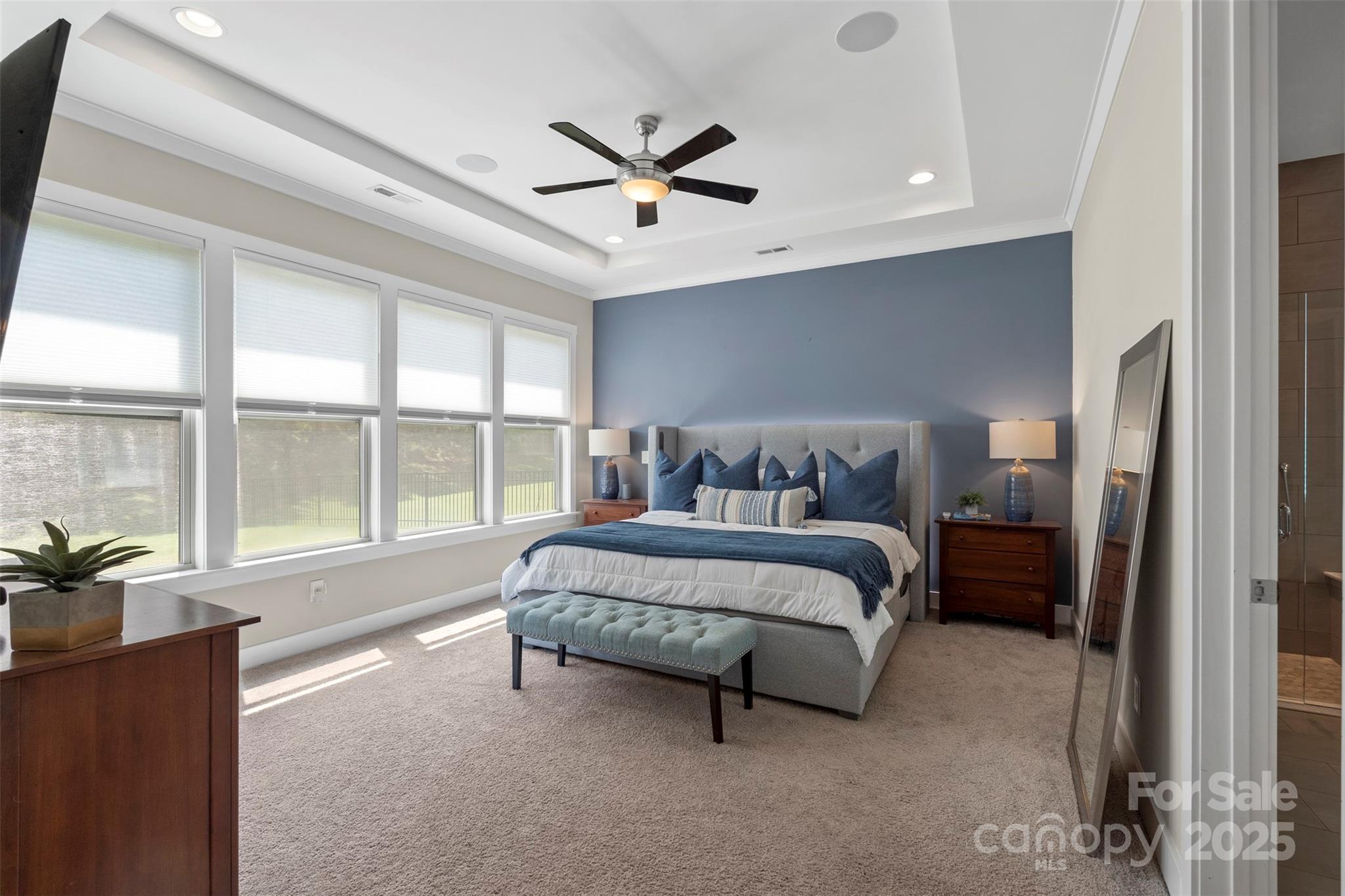 2052 Masons Bend Drive Fort Mill, SC 29708 - Photo 19 of 41 a spacious bedroom with a bed and a large window
