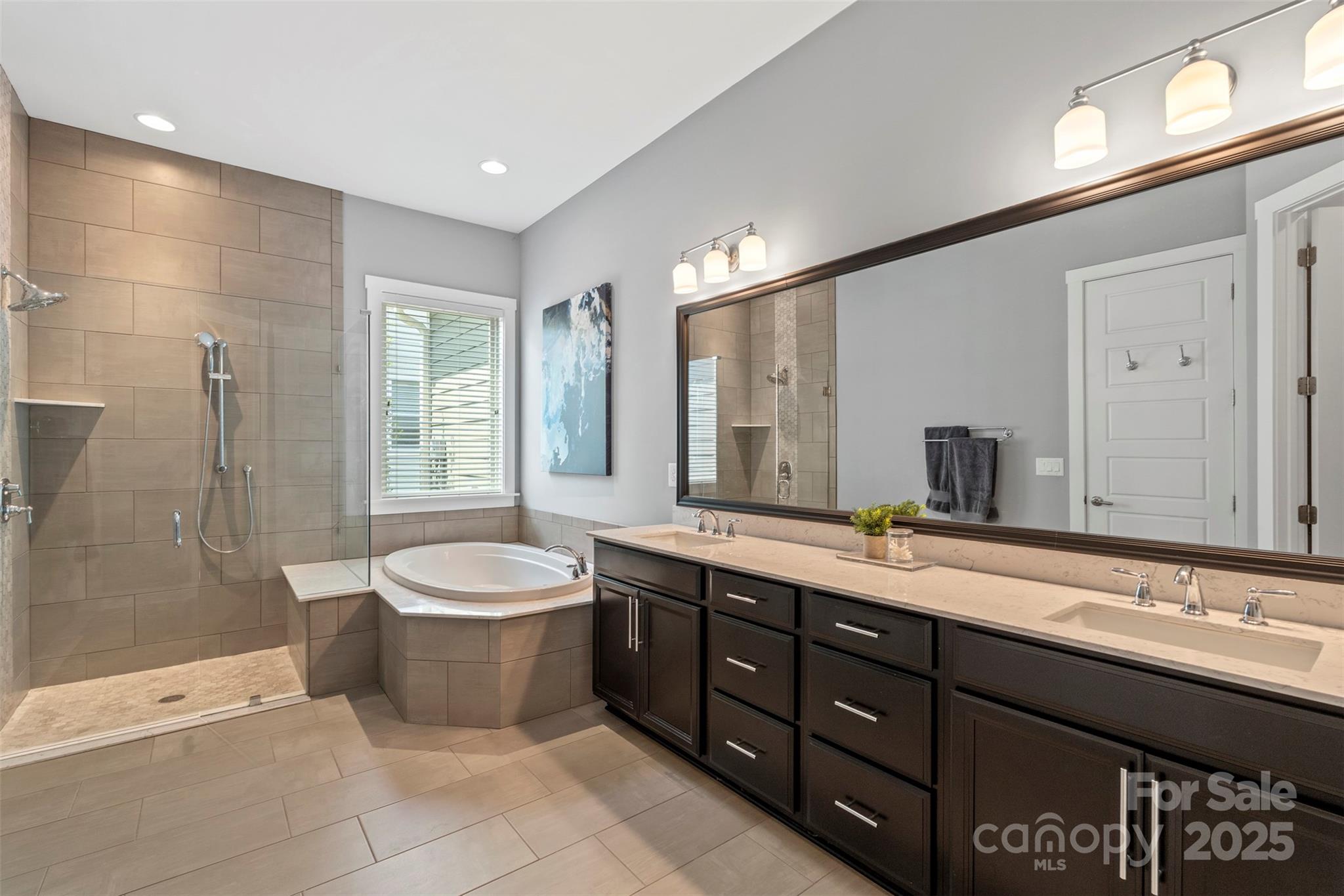 2052 Masons Bend Drive Fort Mill, SC 29708 - Photo 21 of 41 a spacious bathroom with a granite countertop sink toilet a mirror and shower