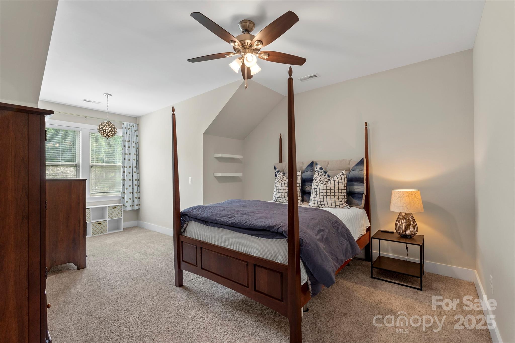 2052 Masons Bend Drive Fort Mill, SC 29708 - Photo 26 of 41 a bed room with a bed and a chandelier