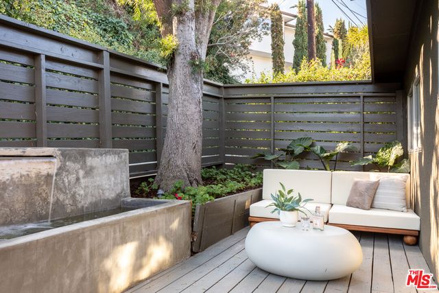 a view of a chairs and table in the patio
