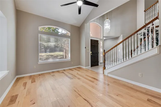 a view of an entryway with wooden floor