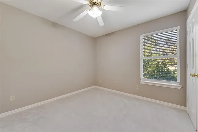 a bathroom with a sink a toilet a large mirror and shower