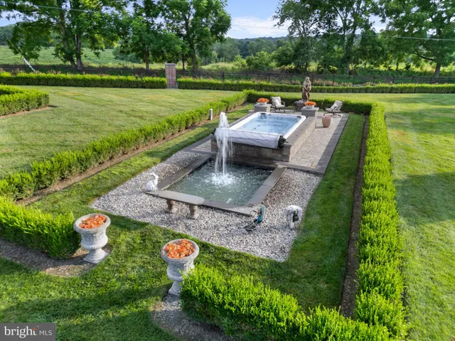 a view of a garden with an outdoor seating