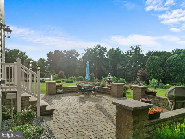 a view of an entryway with wooden floor and door