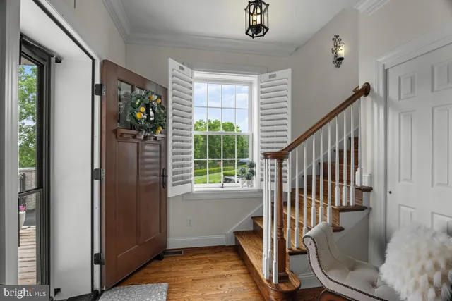 a kitchen with a table chairs stove and cabinets