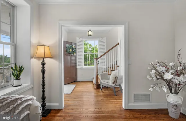 a kitchen with kitchen island a large counter top space a sink stainless steel appliances and cabinets