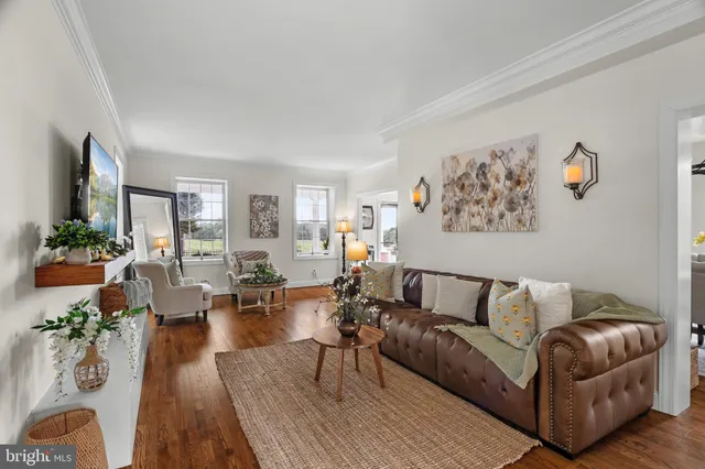 an entryway at livingroom with furniture and wooden floor