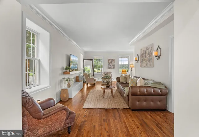 a bathroom with a granite countertop toilet a sink and a mirror