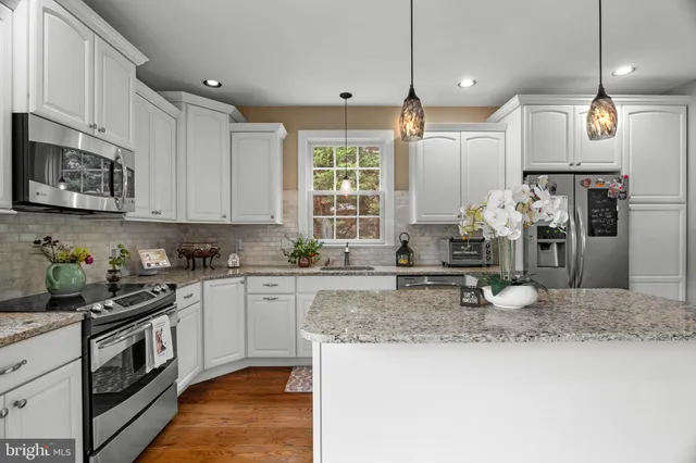 a view of a room with furniture and windows
