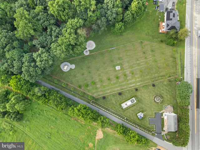a front view of a house with a yard table and chairs