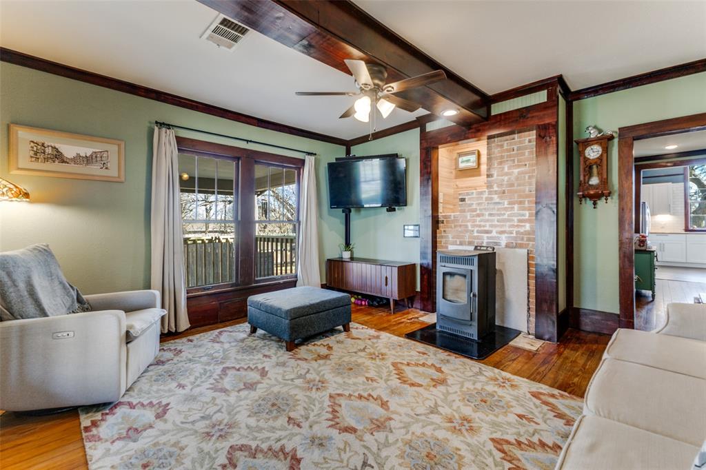 112 Elm Street Howe, TX 75459 - Photo 7 of 26 Brick fireplace exposed and pellet stove fitted