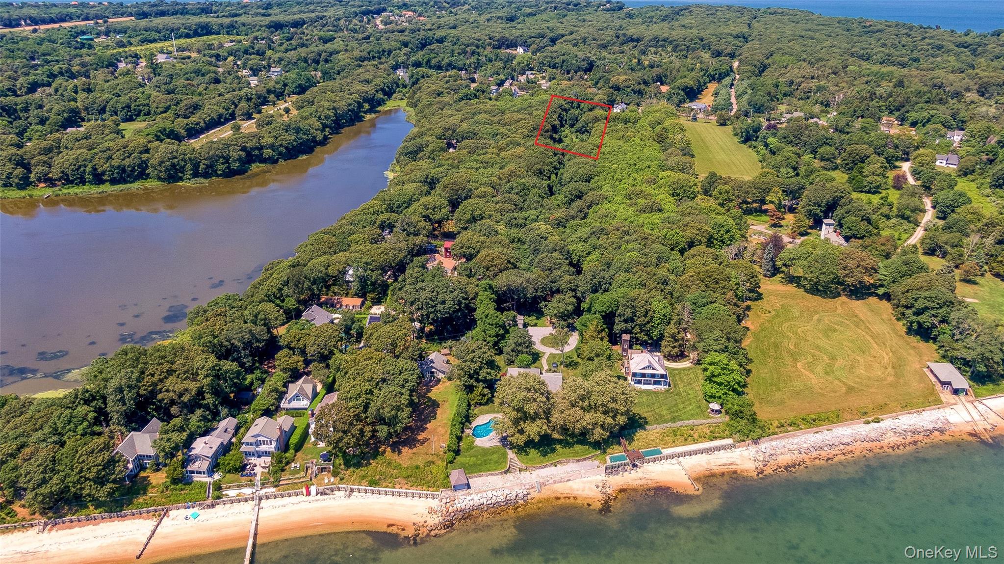 11100 Main Road East Marion, NY 11939 - Photo 4 of 7 Drone / aerial view of a nearby body of water