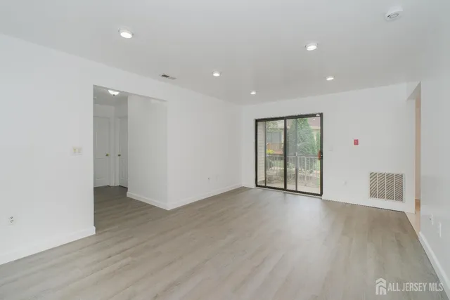 a view of a white building with a outdoor space