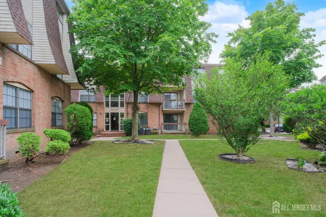 a front view of a building with garden