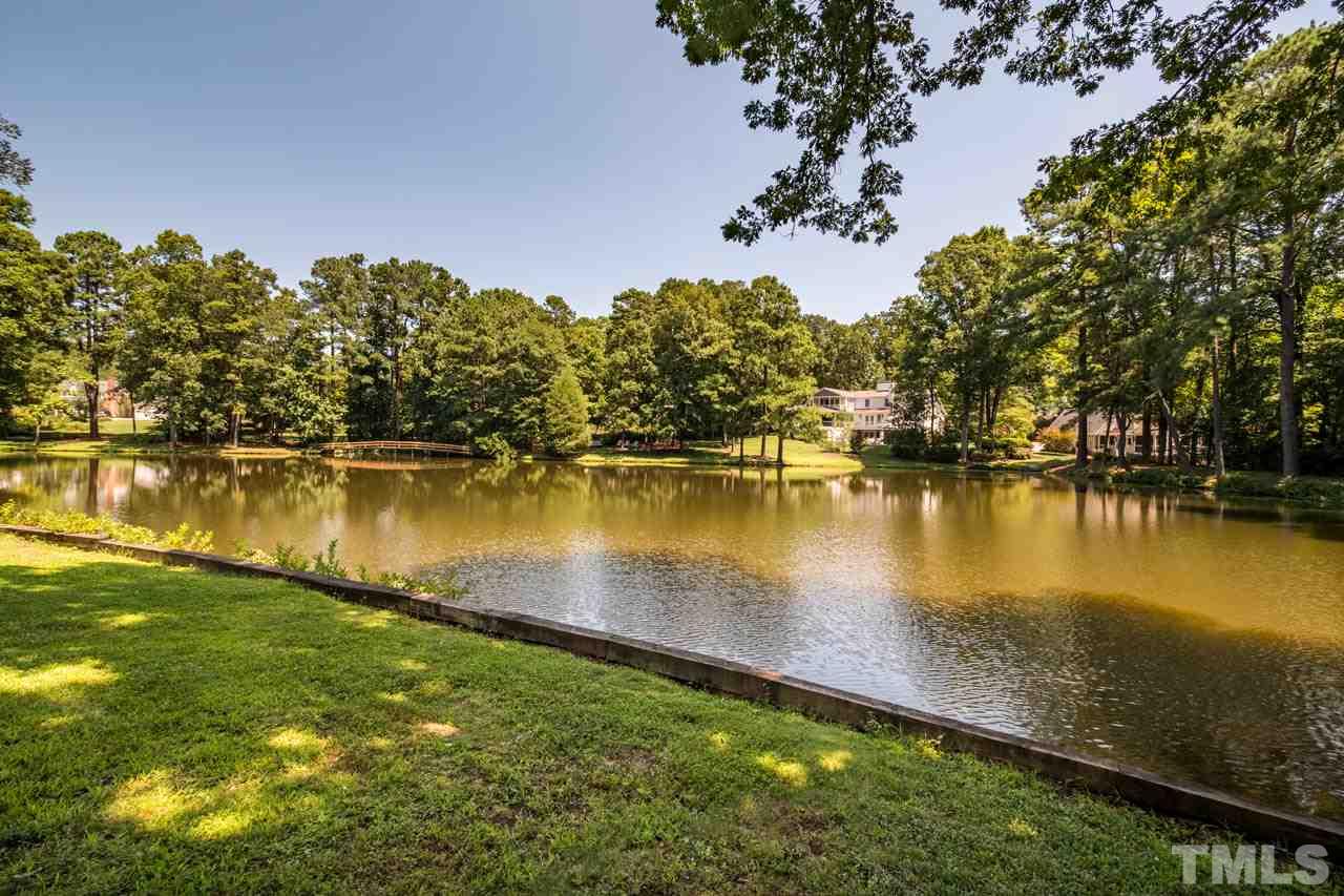 3210 Sussex Road Raleigh, NC 27612 - Photo 3 of 29 a view of a lake with houses in the back