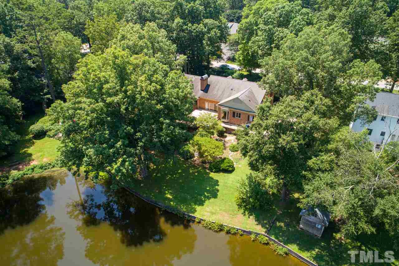 3210 Sussex Road Raleigh, NC 27612 - Photo 27 of 29 an aerial view of a house with swimming pool and garden view