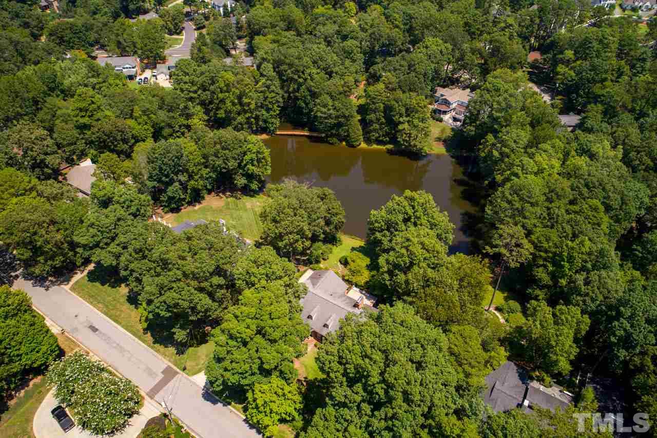 3210 Sussex Road Raleigh, NC 27612 - Photo 28 of 29 an aerial view of residential house with outdoor space and trees all around