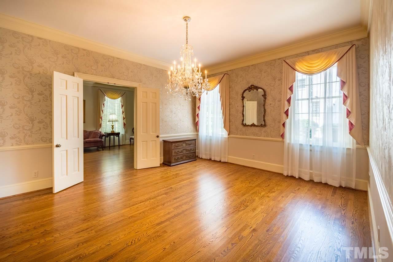 3210 Sussex Road Raleigh, NC 27612 - Photo 8 of 29 a view of a livingroom with wooden floor and furniture