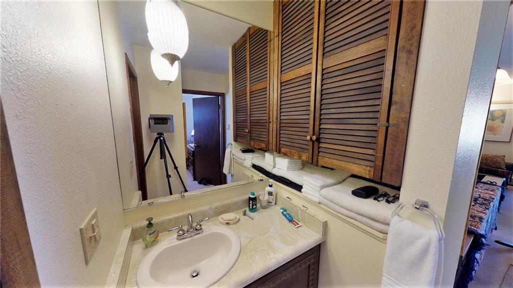 170 Evergreen Road, Unit 305 Dillon, CO 80435 - Photo 13 of 22 a bathroom with a sink and a mirror