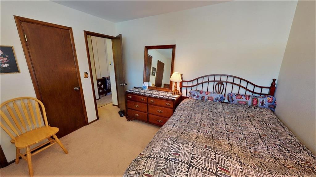 170 Evergreen Road, Unit 305 Dillon, CO 80435 - Photo 15 of 22 a bedroom with furniture and wooden floor