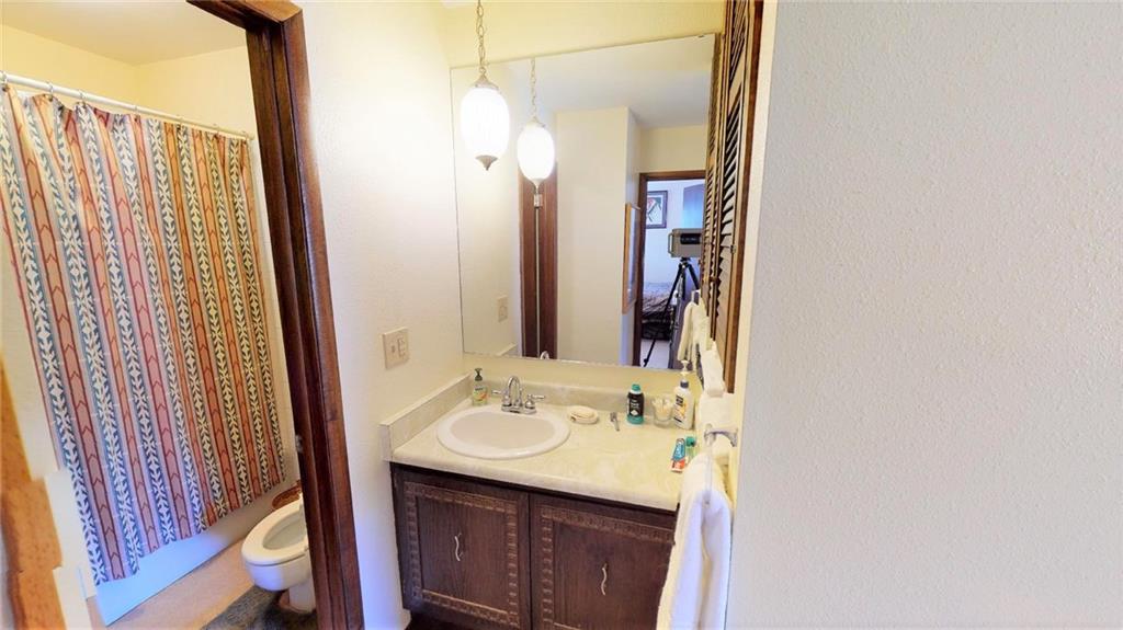 170 Evergreen Road, Unit 305 Dillon, CO 80435 - Photo 17 of 22 a bathroom with a sink and a mirror