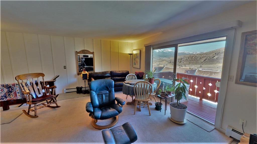 170 Evergreen Road, Unit 305 Dillon, CO 80435 - Photo 6 of 22 a view of a dining room with furniture window and outside view