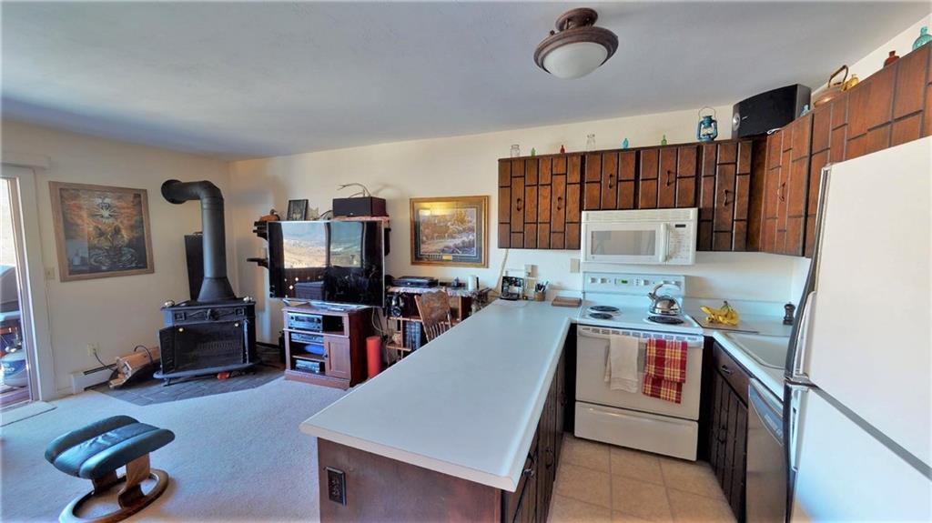 170 Evergreen Road, Unit 305 Dillon, CO 80435 - Photo 9 of 22 a room with furniture and a flat screen tv