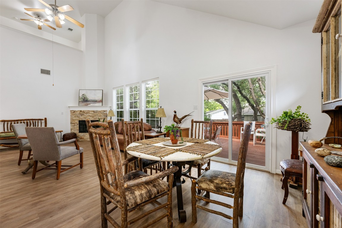 11000 Anderson Mill Road, Unit 63 Austin, TX 78750 - Photo 14 of 40 a view of a dining room with furniture window and wooden floor