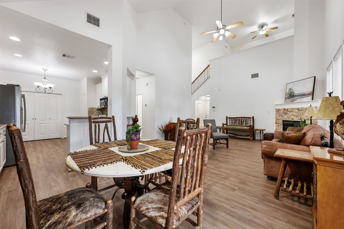 11000 Anderson Mill Road, Unit 63 Austin, TX 78750 - Photo 15 of 40 a view of a dining room with furniture and wooden floor