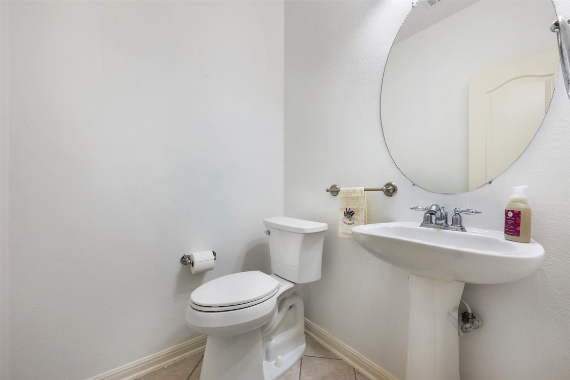 11000 Anderson Mill Road, Unit 63 Austin, TX 78750 - Photo 27 of 40 a bathroom with a sink toilet and a mirror