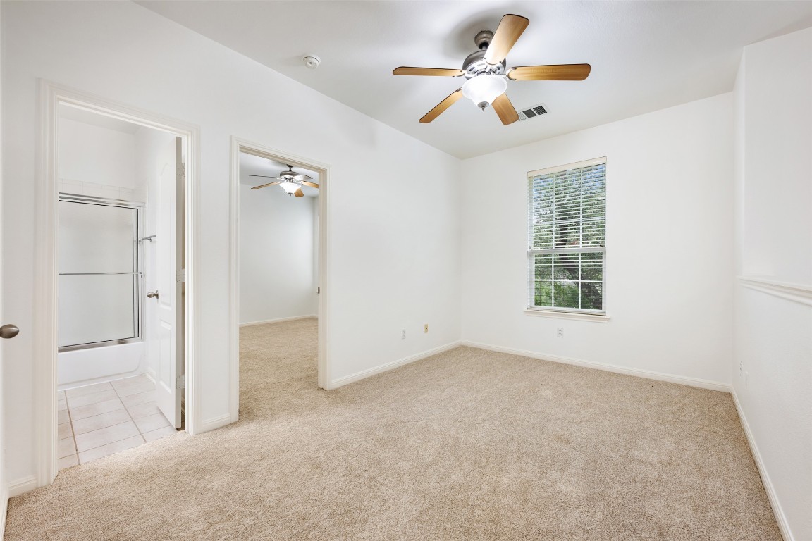 11000 Anderson Mill Road, Unit 63 Austin, TX 78750 - Photo 29 of 40 wooden floor in an empty room with a window