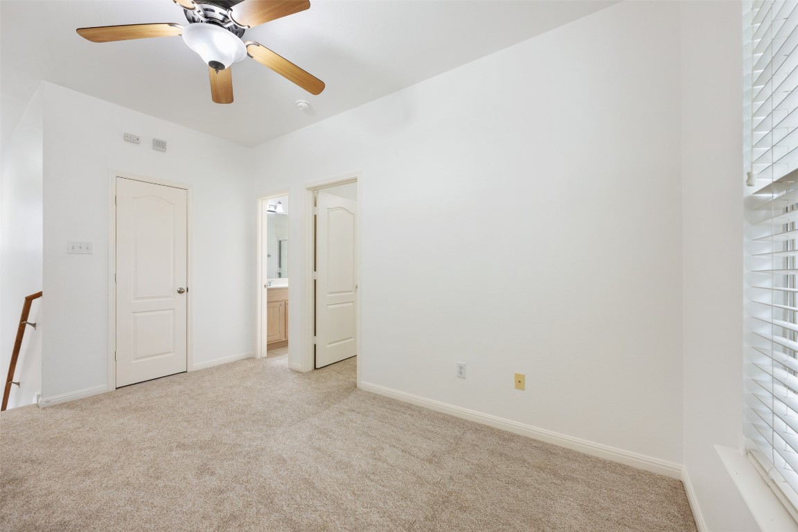 11000 Anderson Mill Road, Unit 63 Austin, TX 78750 - Photo 30 of 40 wooden floor in an empty room with a window