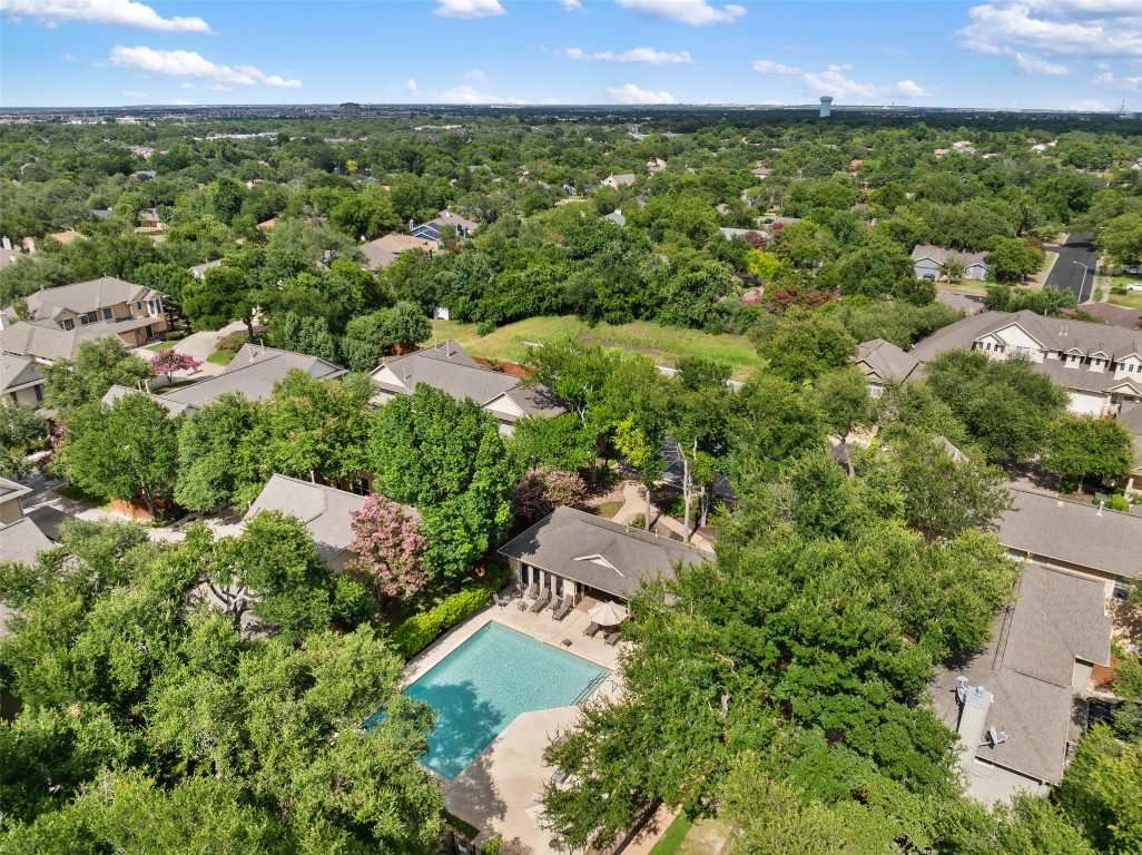 11000 Anderson Mill Road, Unit 63 Austin, TX 78750 - Photo 38 of 40 an aerial view of residential houses with outdoor space and trees