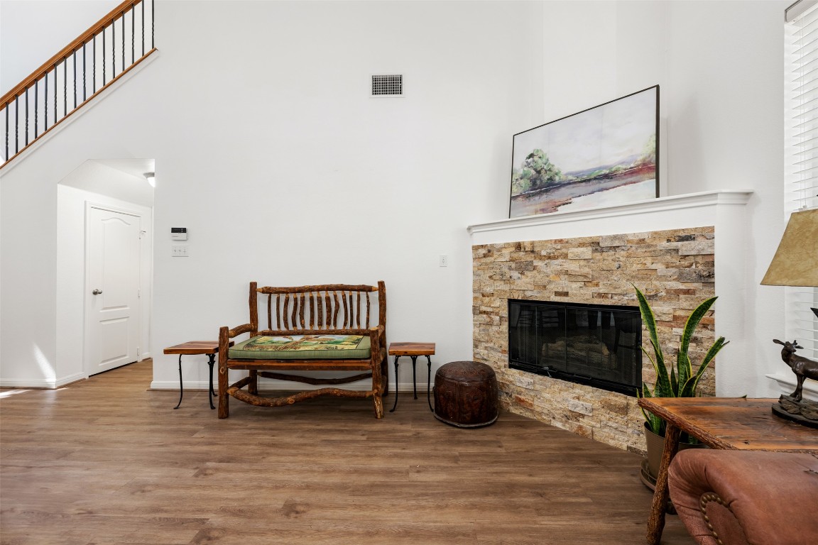 11000 Anderson Mill Road, Unit 63 Austin, TX 78750 - Photo 10 of 40 a living room with furniture and a fireplace