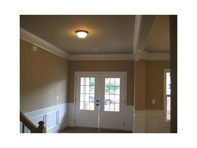 a living room with a black gate