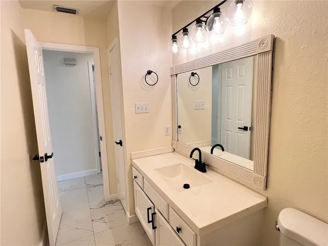 a bathroom with a sink a mirror and a shower