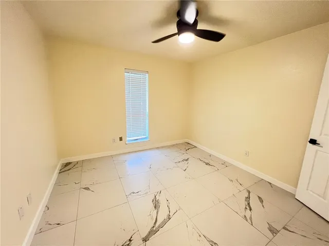 an empty room with fan